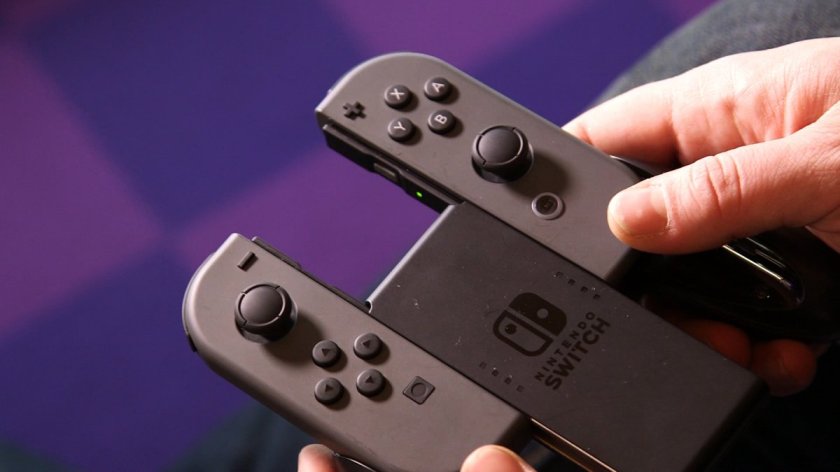 This is the Nintendo Switch gamepad. The two sections of the Joy-Con are attached to a plastic shell called the Joy-Con Grip. This is part of the modular nature of the Switch. They slide on along a rail.